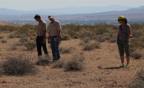 Rob Sweeten, Bureau of Land Management Old Spanish Trail National Historic Trail Administrator, Mike Taylor and Jill Jensen of NPS-NTIR, look over terrain on Mormon Mesa. Photo by John Hiscock. Nevada