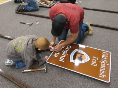 Volunteers and Boy Scouts prepare signs in Iron County, Utah. Photo courtesy St. George News. Utah